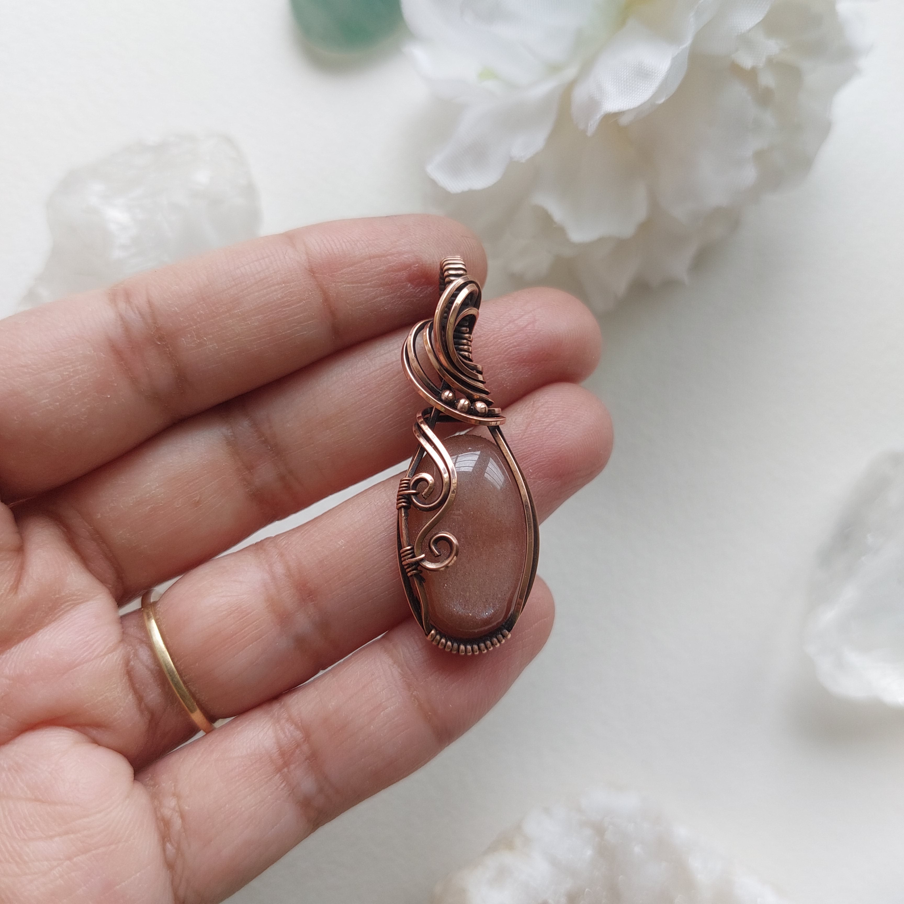 Peach moonstone with sunstone inclusions- wire wrapped copper handmade crystal pendant