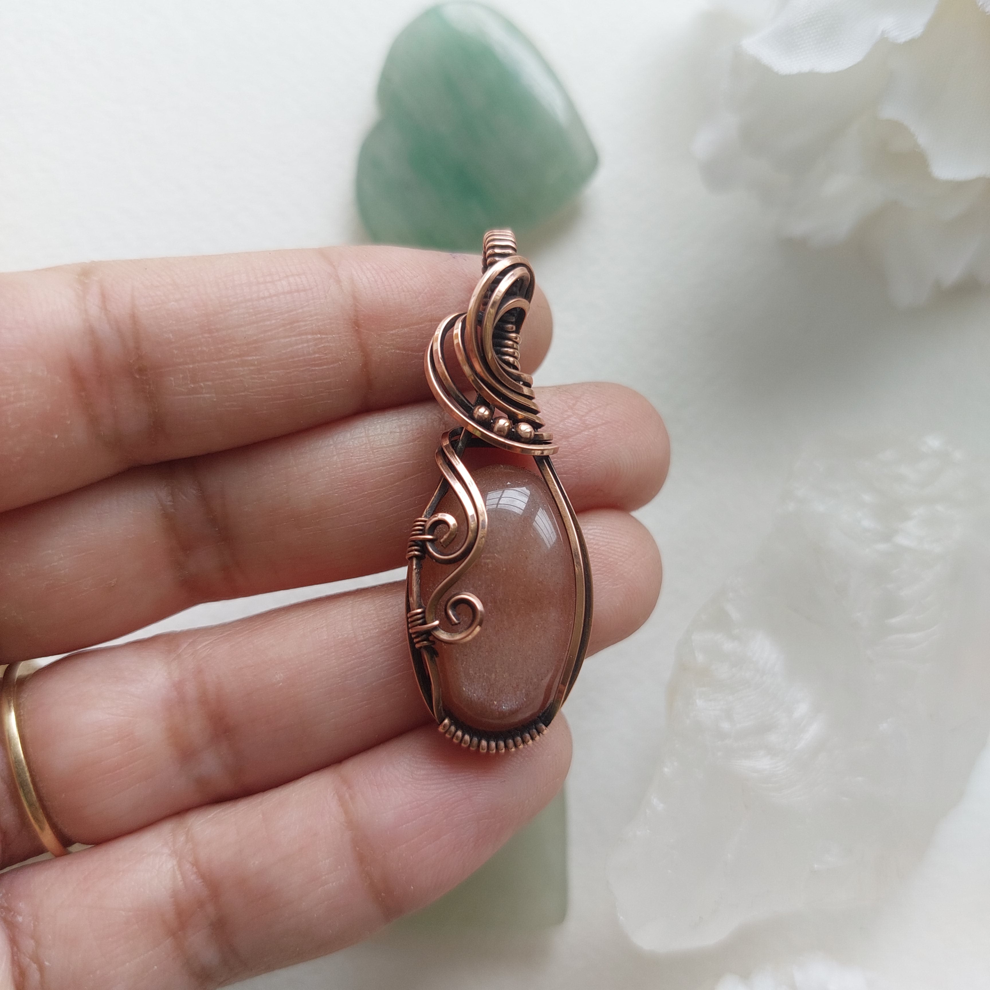 Peach moonstone with sunstone inclusions- wire wrapped copper handmade crystal pendant