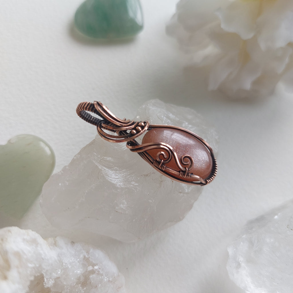 Peach moonstone with sunstone inclusions- wire wrapped copper handmade crystal pendant