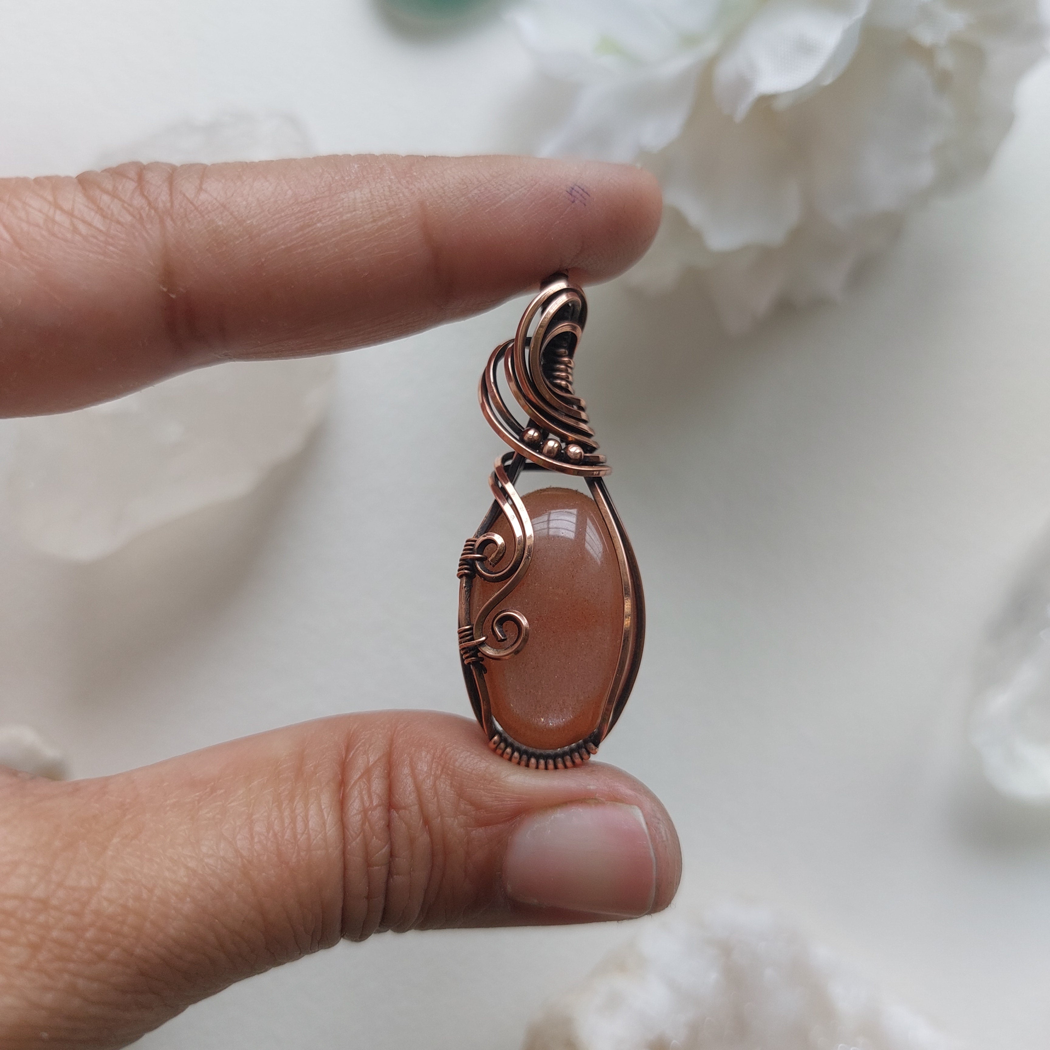 Peach moonstone with sunstone inclusions- wire wrapped copper handmade crystal pendant