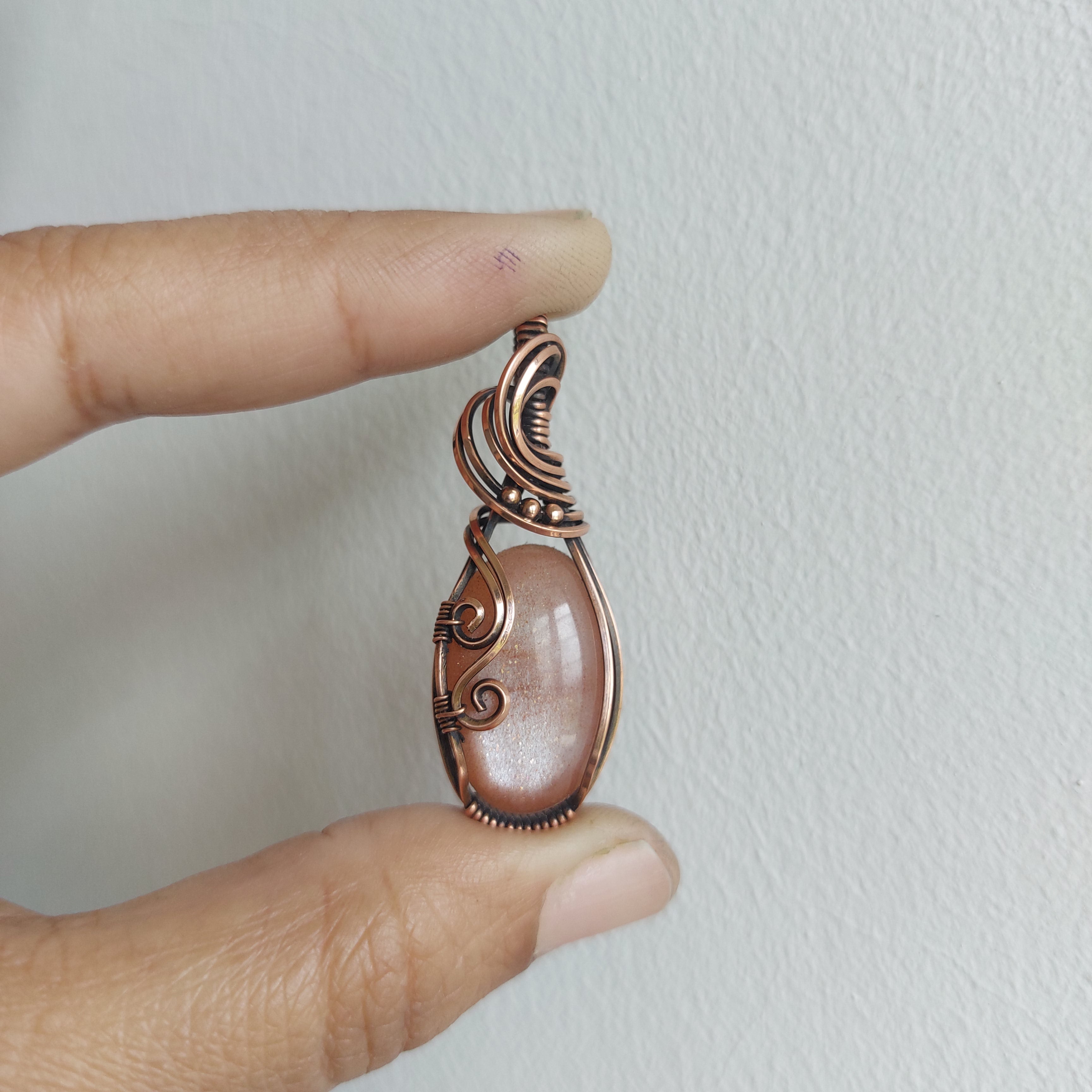 Peach moonstone with sunstone inclusions- wire wrapped copper handmade crystal pendant